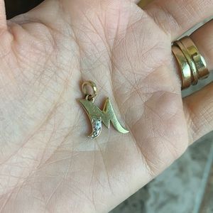 Real gold and diamond “M” pendant
